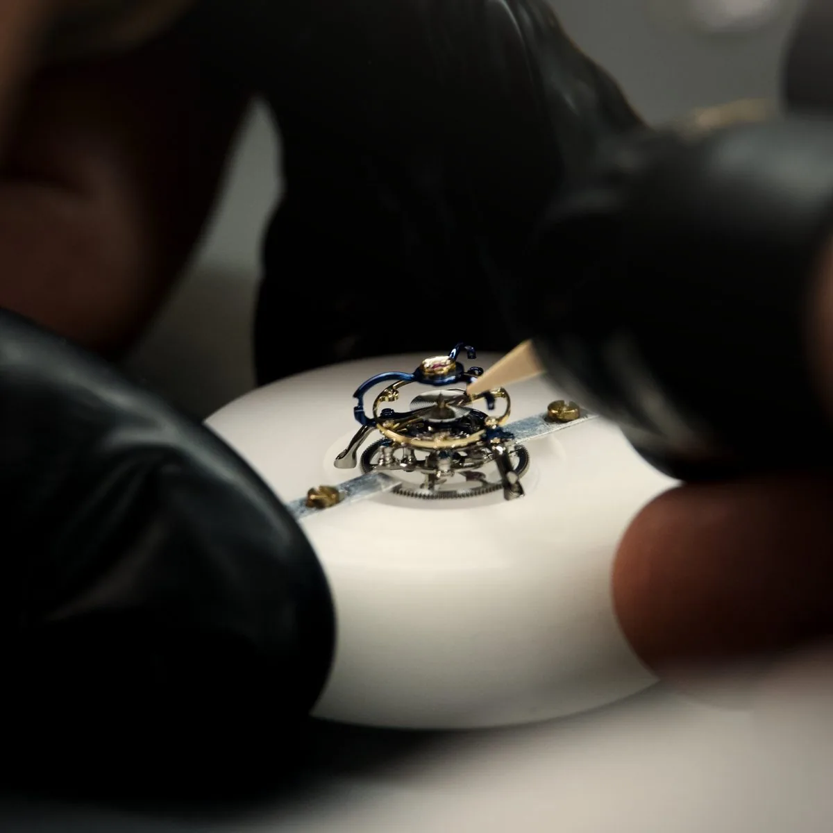 A watchmaker assembling the Récital 28 tourbillon